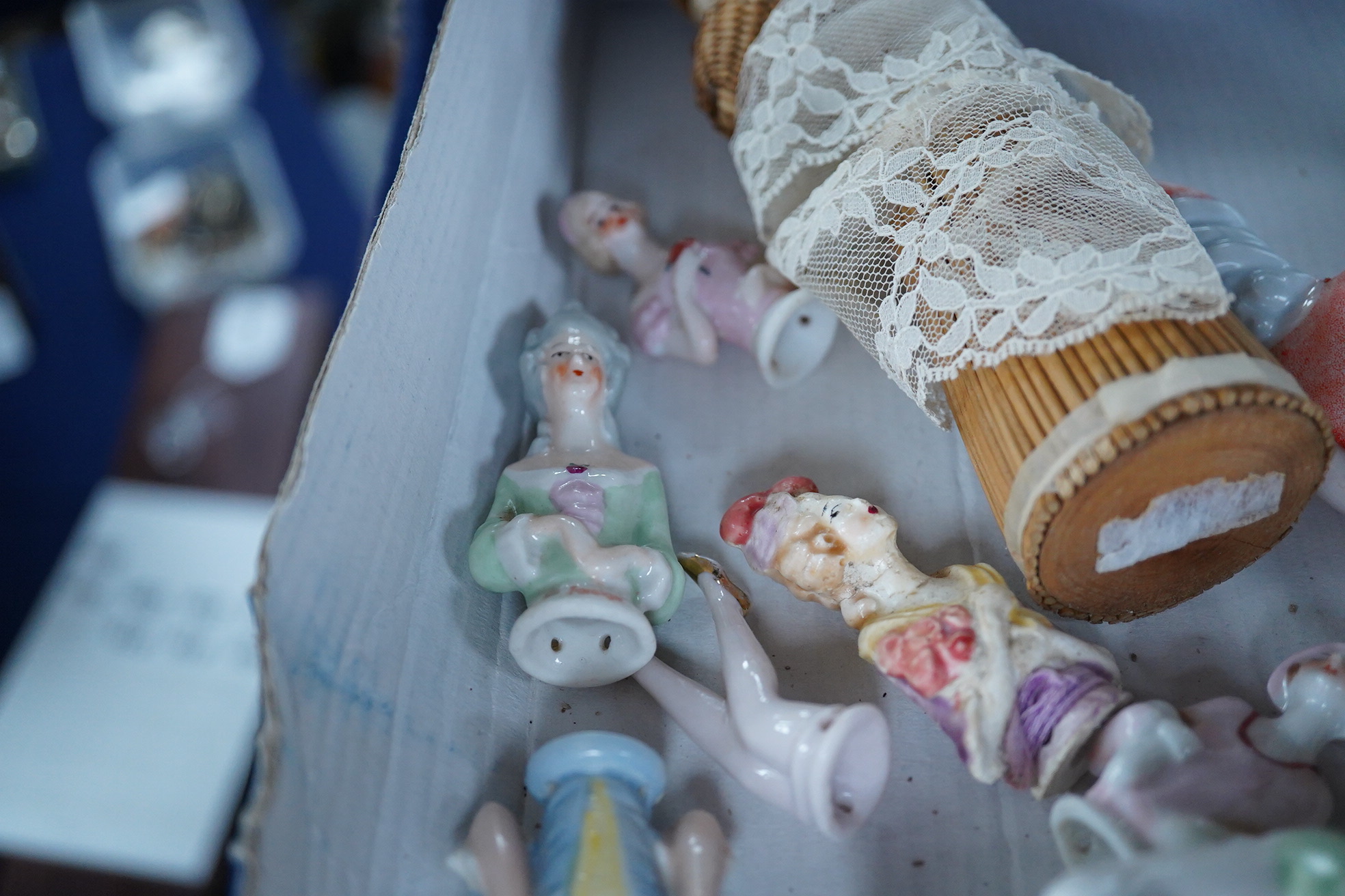 A collection of vintage porcelain half dolls and a bisque porcelain example with jointed limbs